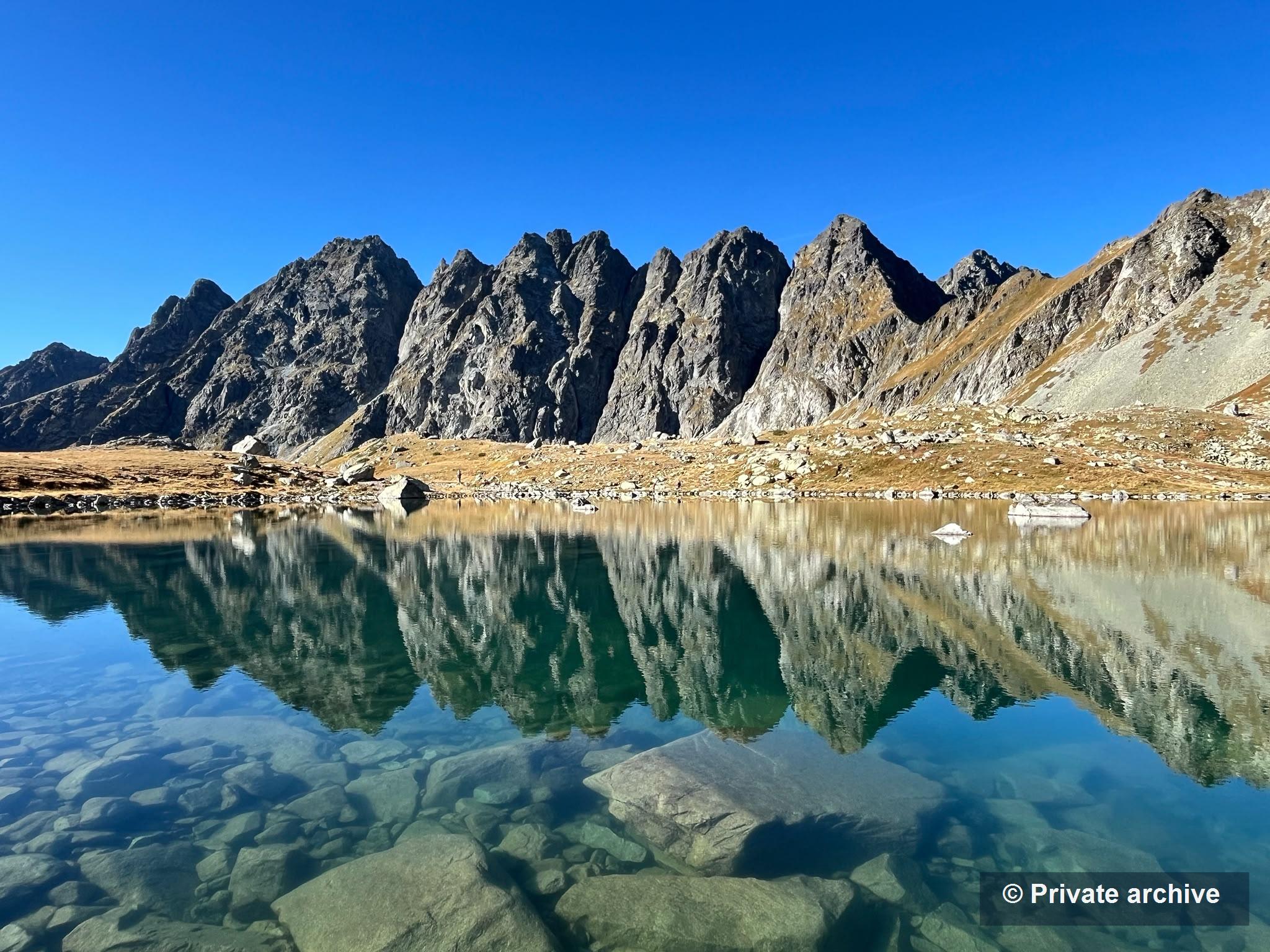 Tatra Mountains lake with reflected peaks